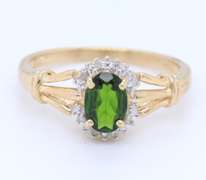 Charming Yellow Gold oval Peridot and Diamond Halo Ring