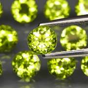 Fantastic 7.00ct 5mm round brilliant cut Peridot set