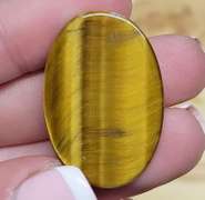Full body shimmer! 30.41ct Golden Tiger Eye cabochon