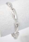Stylish Sterling Silver Bracelet With CZ Stones And Alternating Matte And Polished Texture.