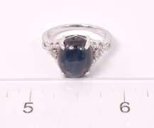 Stunning 8.61CTS Cabochon-Cut Star Sapphire and 0.09CTW Diamond Ring in Sterling Silver
