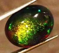 Striking 2.39ct full body and full spectrum flashing Black Opal