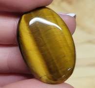 Full body shimmer! 30.41ct Golden Tiger Eye cabochon