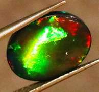 Striking 2.39ct full body and full spectrum flashing Black Opal