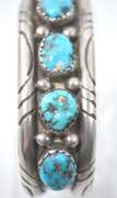 5 Turquoise Stones Set In A Thick Sterling Silver Bracelet.