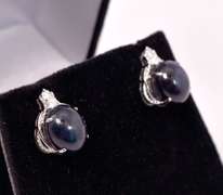 Captivating 12.39CTW Oval Cabochon-Cut Star Sapphire & 0.20CTW Diamond Earrings in Sterling Silver
