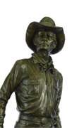 Cowboy with Saddle and Gun Bronze Sculpture