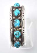 5 Turquoise Stones Set In A Thick Sterling Silver Bracelet.