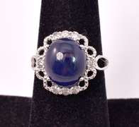 Captivating 8.65CTS Cabochon-Cut Star Sapphire & 0.39CTW Diamond Ring in Sterling Silver