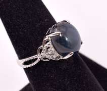 Stunning 8.61CTS Cabochon-Cut Star Sapphire and 0.09CTW Diamond Ring in Sterling Silver