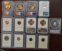 Lot Of 13 Coins In Plastic Holders.