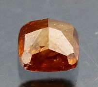 Stunning .28ct cushion cut red orange Diamond