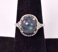 Beautiful 5.96CTS Cabochon-Cut Star Sapphire and 0.29CTW Diamond Ring in Sterling Silver