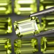 Brilliant 7.62ct 12pc set of matched emerald cut Peridot