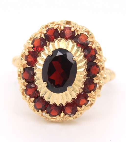 Powerful Yellow Gold oval Garent and Halo Garnet Ring