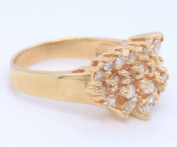 Handsome Marquoise and Round Cut Diamond Cluster Ring