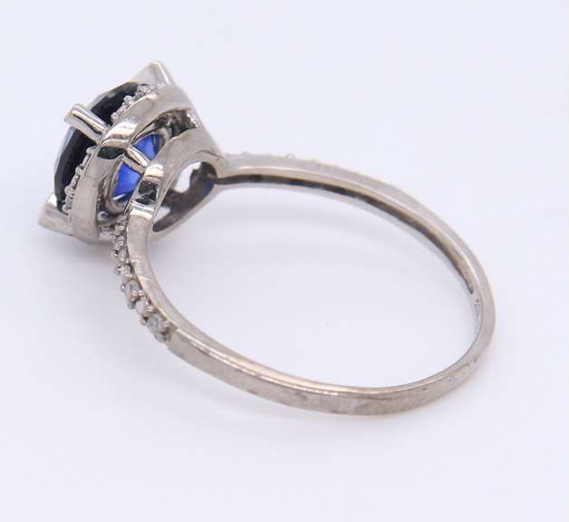 Attractive White Gold Round Blue Stone and Diamond Halo Ring