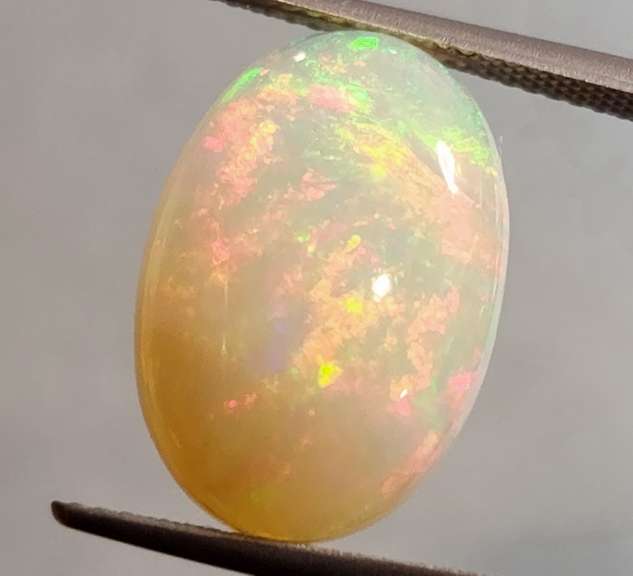 Full cover! 8.08ct rolling floral flashing Welo Opal