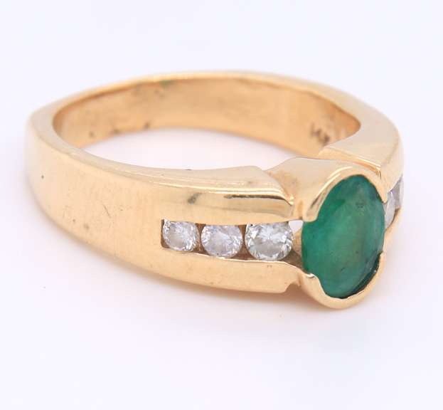 Incredible Yellow Gold oval Cut Emerald and Diamond Ring