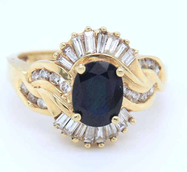Attractive Yellow Gold oval Blue Sapphire and Baguette Diamond Ring