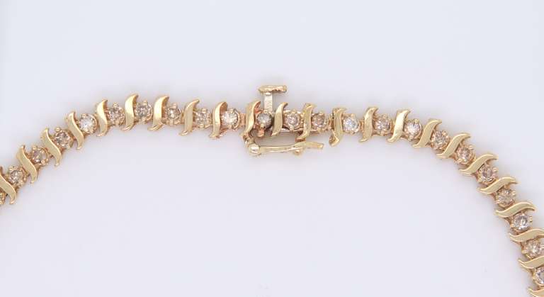 Gorgeous Yellow Gold Diamond S Tennis Bracelet