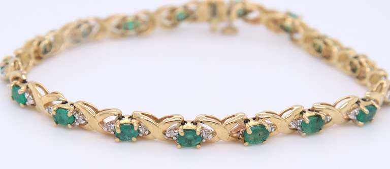 Handsome Yellow Gold Emerald and Diamond Tennis Bracelet
