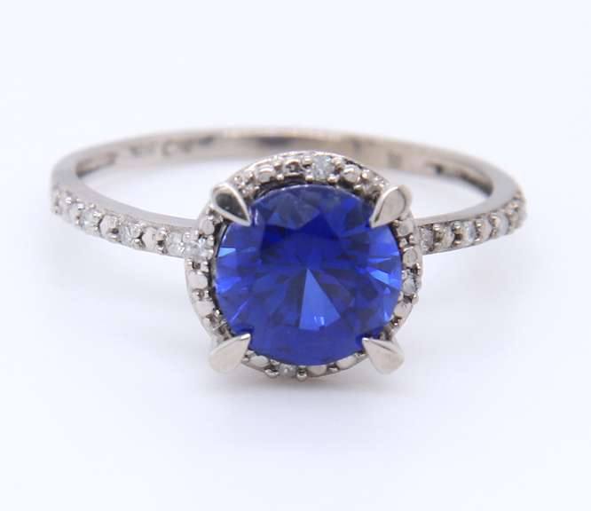 Attractive White Gold Round Blue Stone and Diamond Halo Ring