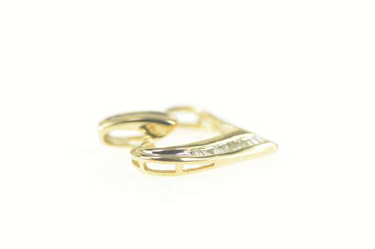 10K Yellow Gold 0.20 Ctw Diamond Baguette Heart Symbol Pendant