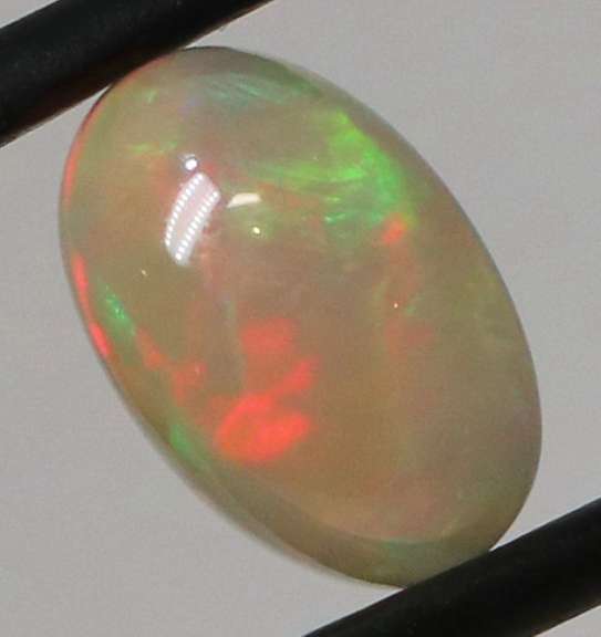 Full body flashing 1.86ct smoldering block and chaff Opal