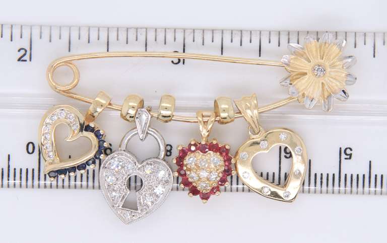 Attractive Yellow Gold Safety Pin with 4 Charms