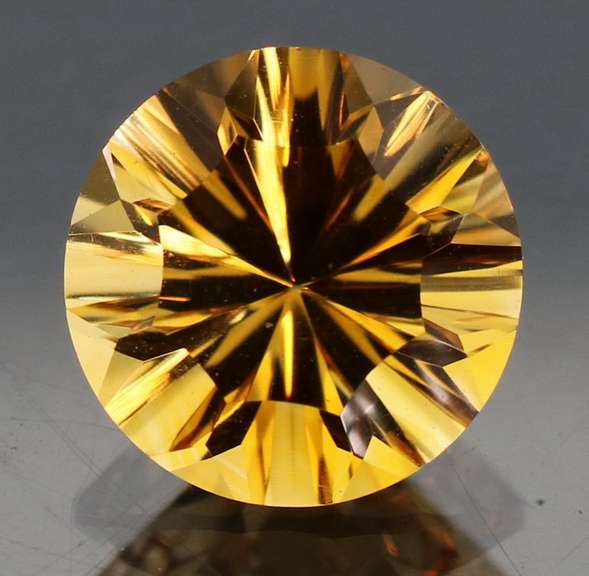 Fiery 3.06ct concave cut Citrine solitaire