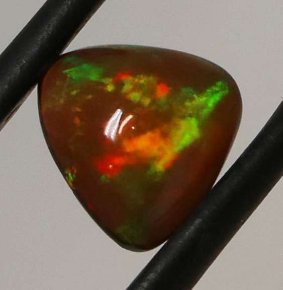 Fiery flashing 1.08ct Ethiopian Semi-black Opal