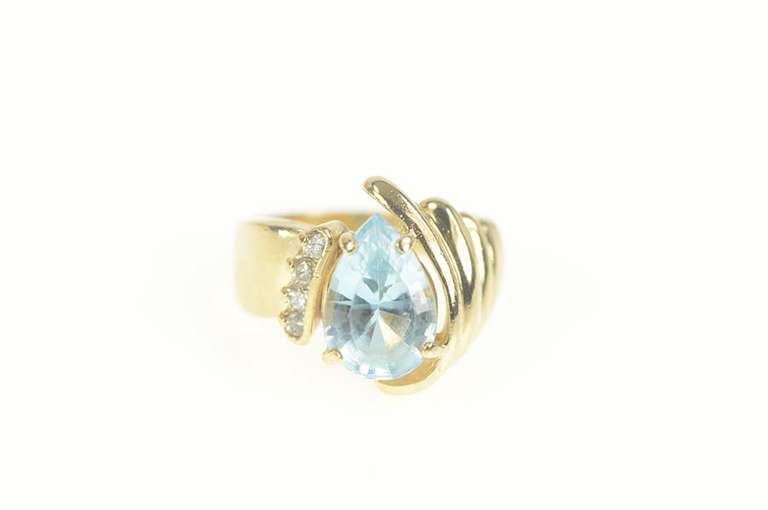 14K Yellow Gold 3.65 Ctw Pear Blue Topaz Diamond Accent Ring