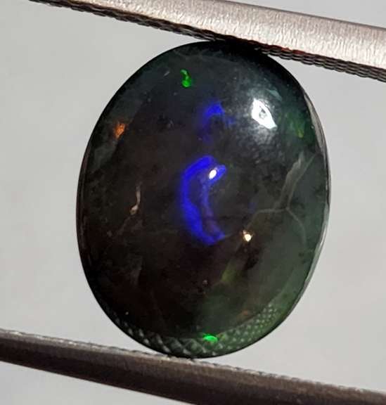 Glistening 3.61ct Welo Black Opal cabochon