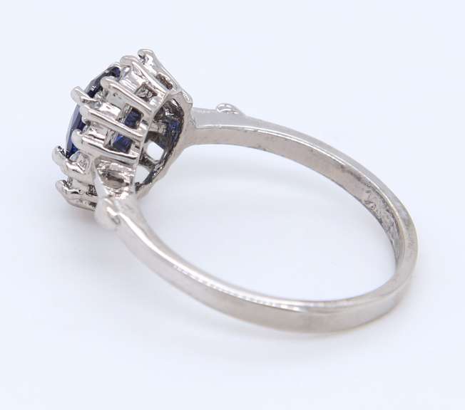 Charming White Gold Tanzanite and Diamond Halo Ring