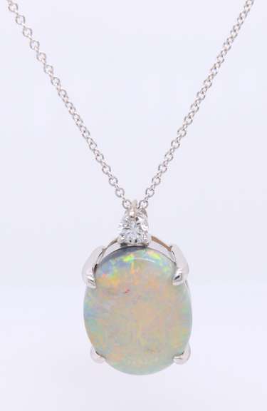 Wonderful White Gold oval Opal and Diamond Pendant on Chain
