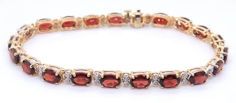 Wonderful Yellow Gold oval Garnet and Diamond Bracelet