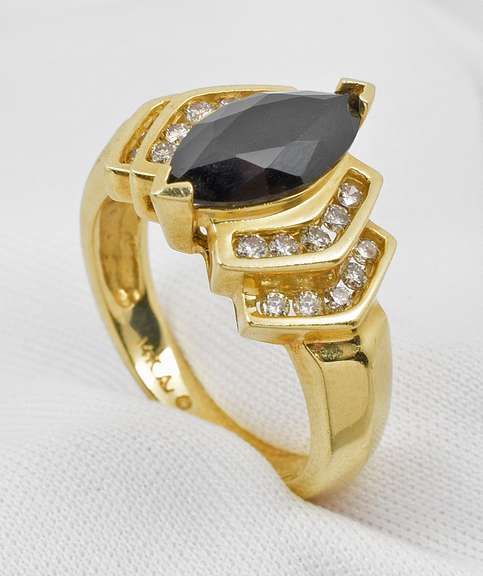 Elegant Marquise Onyx and Diamond Ring.