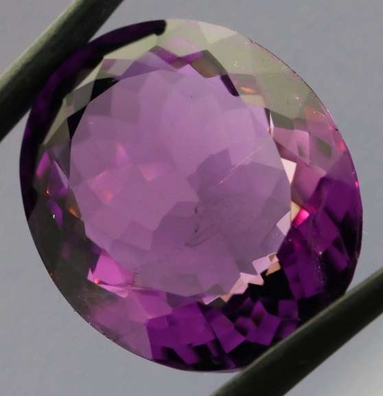 Substantial oval cut 21.43ct violet Amethyst