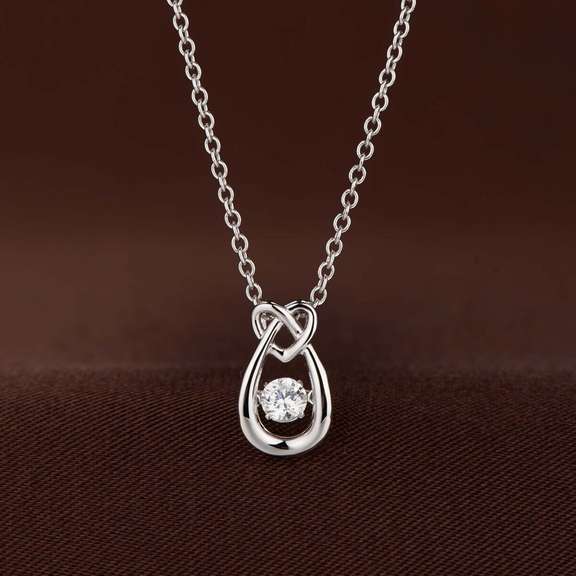 Pear shape With heart on top silver dancing pendant