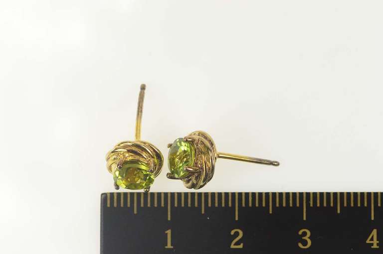 Sterling Silver Round Peridot Twist Design Statement Stud Earrings