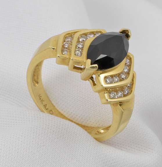 Elegant Marquise Onyx and Diamond Ring.