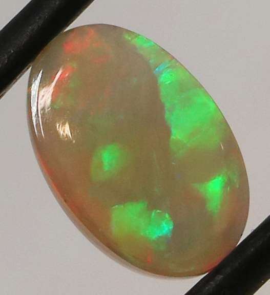 Full body flashing 1.86ct smoldering block and chaff Opal