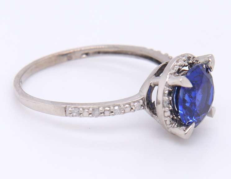 Attractive White Gold Round Blue Stone and Diamond Halo Ring
