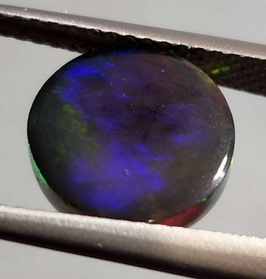 Full body flashing 3.28ct Welo Black Opal