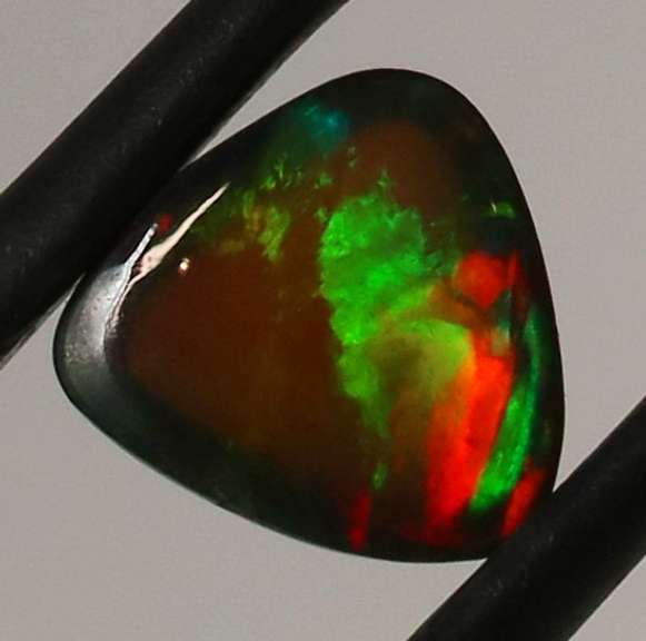 Fiery flashing 1.08ct Ethiopian Semi-black Opal