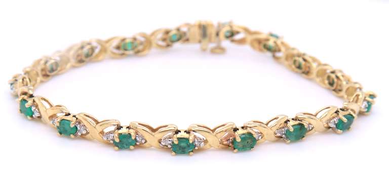 Handsome Yellow Gold Emerald and Diamond Tennis Bracelet