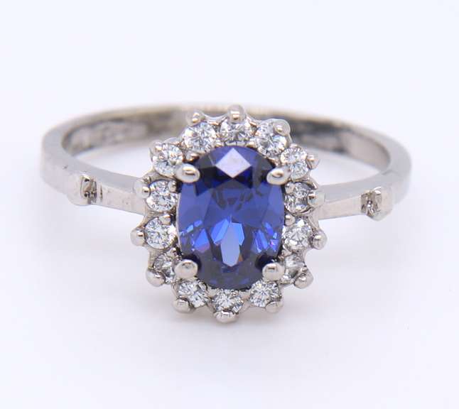 Charming White Gold Tanzanite and Diamond Halo Ring