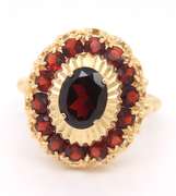 Powerful Yellow Gold oval Garent and Halo Garnet Ring