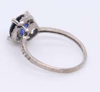 Attractive White Gold Round Blue Stone and Diamond Halo Ring